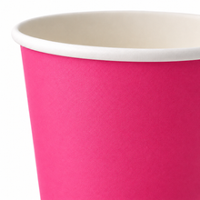 A close-up of a hot pink paper cup with a white rim, shown against a plain white background.