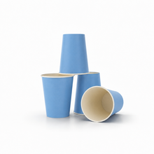 Four light blue paper cups with cream-colored interiors, arranged on a clean white background.