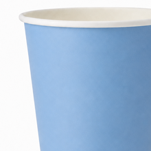 A close-up of a light blue paper cup with a white rim, shown against a plain white background.