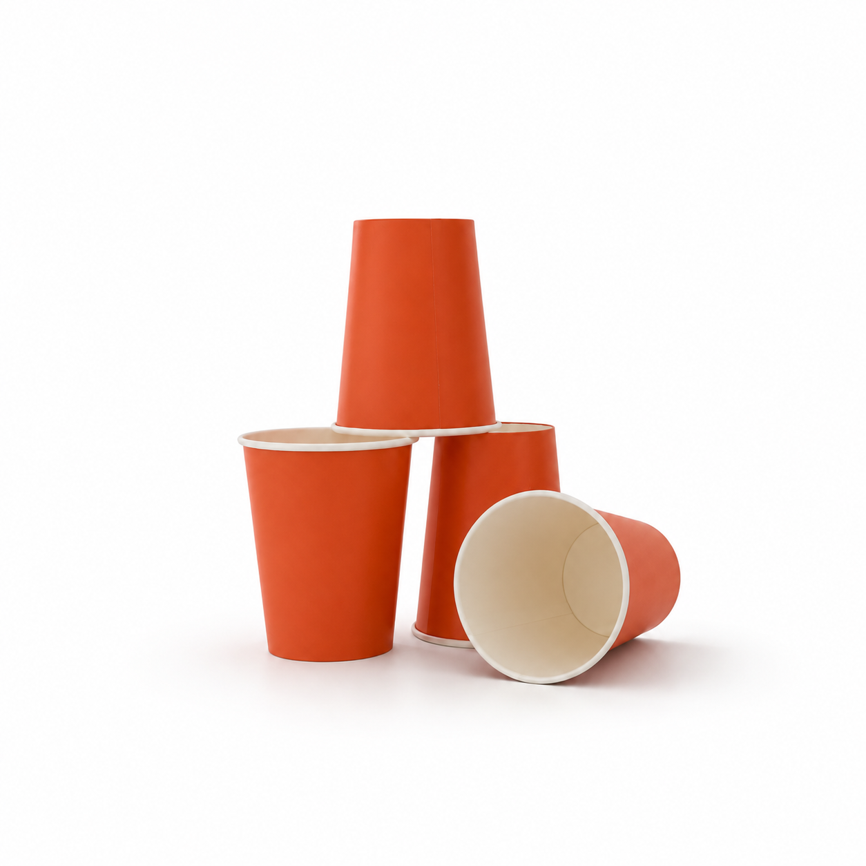 Three orange paper cups with white interiors, arranged in a stack on a clean white background.