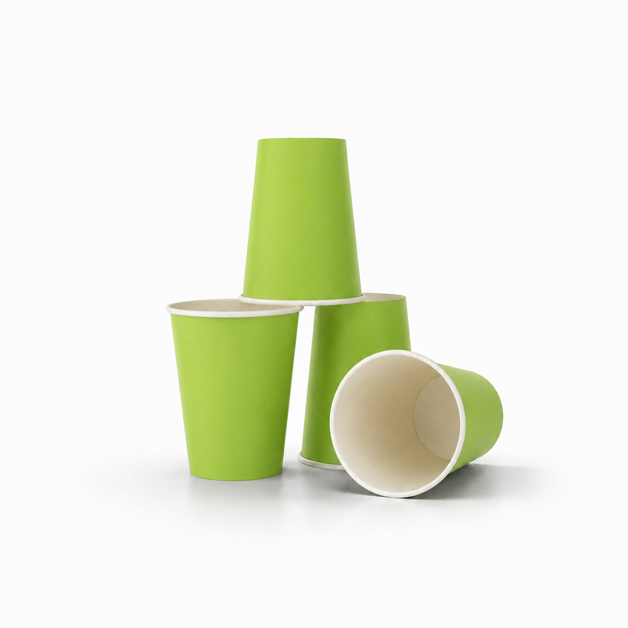 Four light green paper cups with white interiors, arranged on a clean white background.