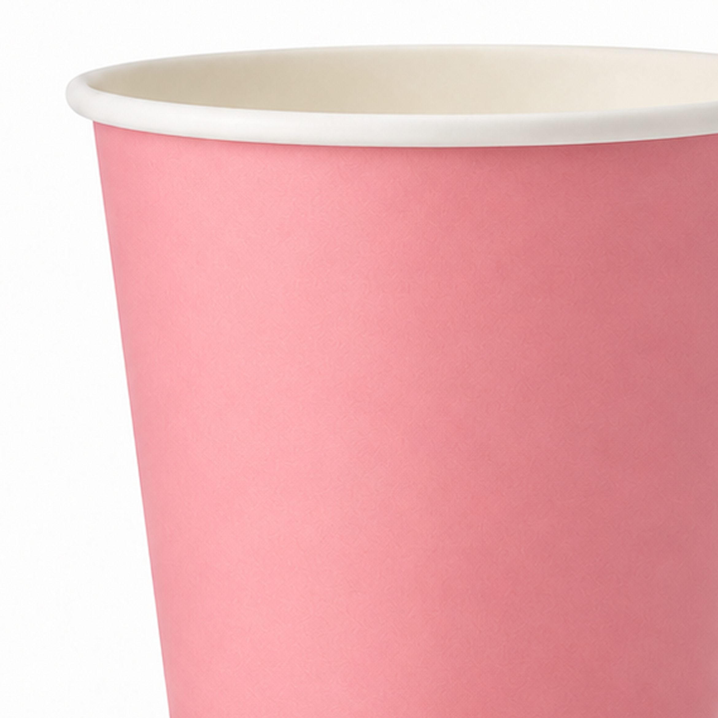 A close-up of a pink paper cup with a white rim, showing the interior side against a plain white background.