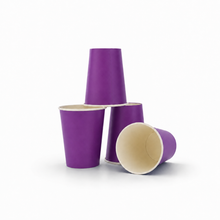 Three purple paper cups with cream-colored interiors, arranged in a stack and flat on a white background.