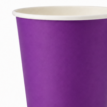 A close-up of a purple paper cup with a white inner lining, shown against a plain white background.
