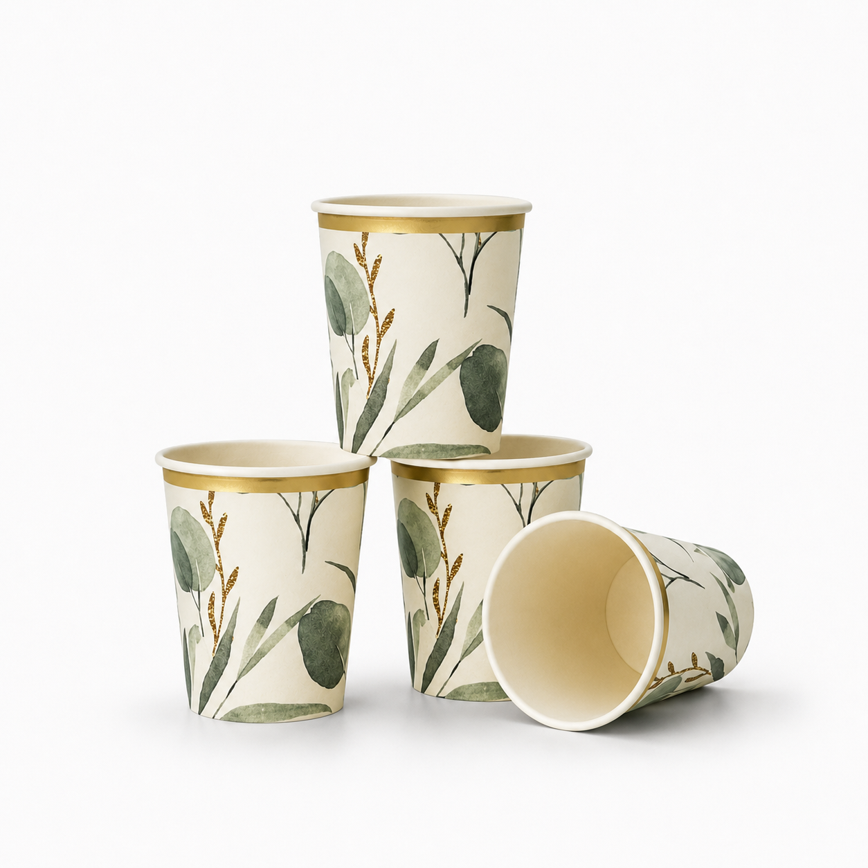 Four paper cups with a botanical pattern of green leaves and gold accents, arranged on a clean white background.